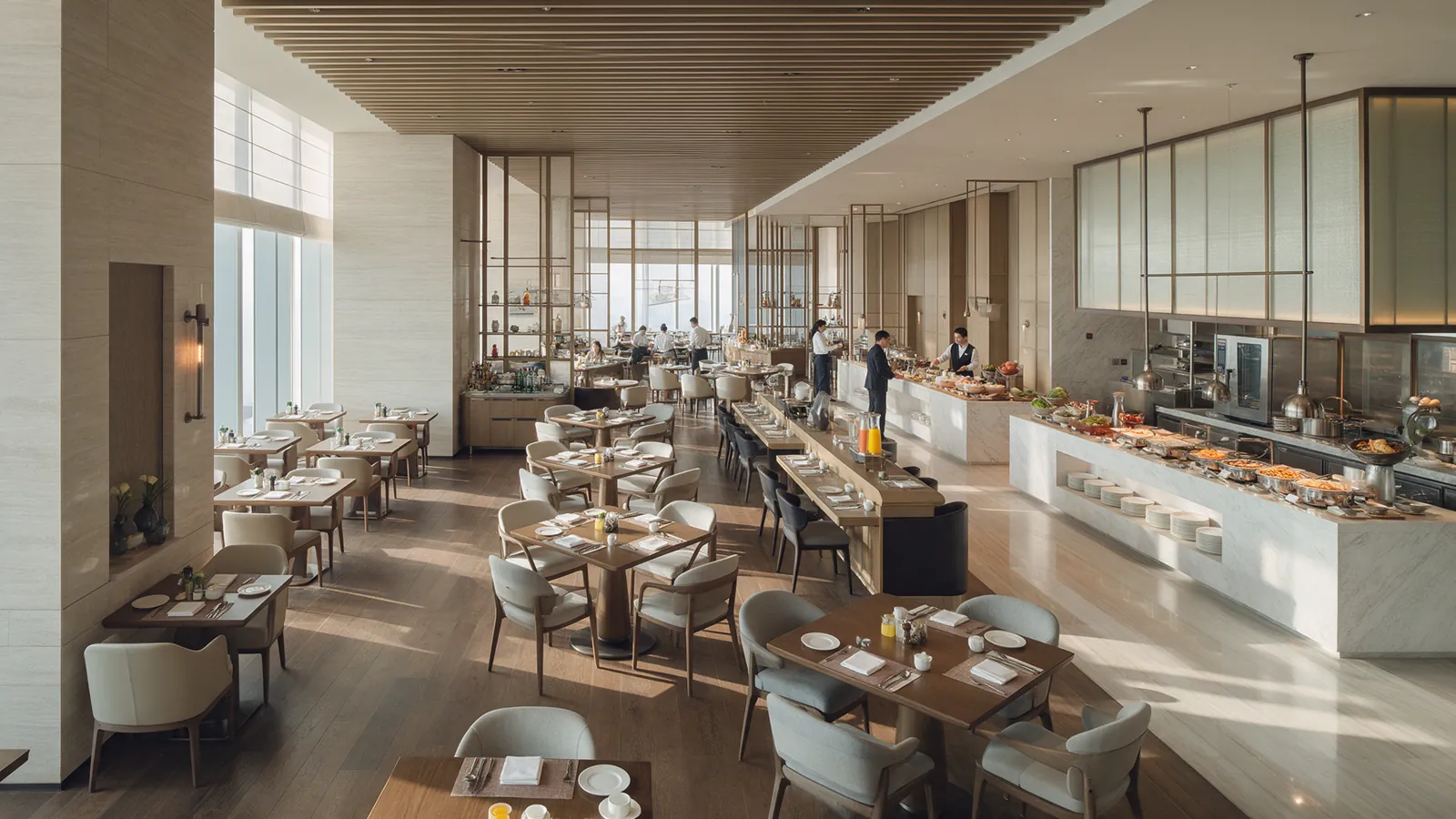 Illustrative hotel restaurant and service team during a quiet breakfast period.